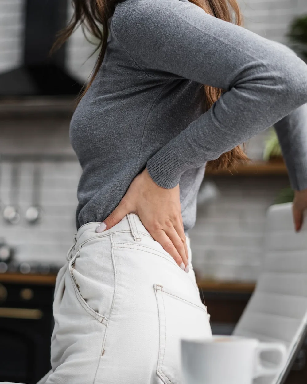 Dr. Shawn Handeland assessing spinal alignment during an examination